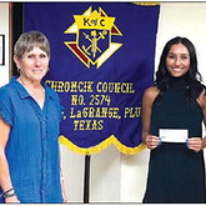 Receiving a Knights of Columbus Scholarship in honor of deceased member Edward Posas is Gabrielle Janak.