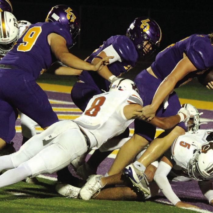 La Grange quarterback Clayton Cooper runs his way into the endzone Friday. He ran for 101 yards and threw for 140. Photo by Jeff Wick