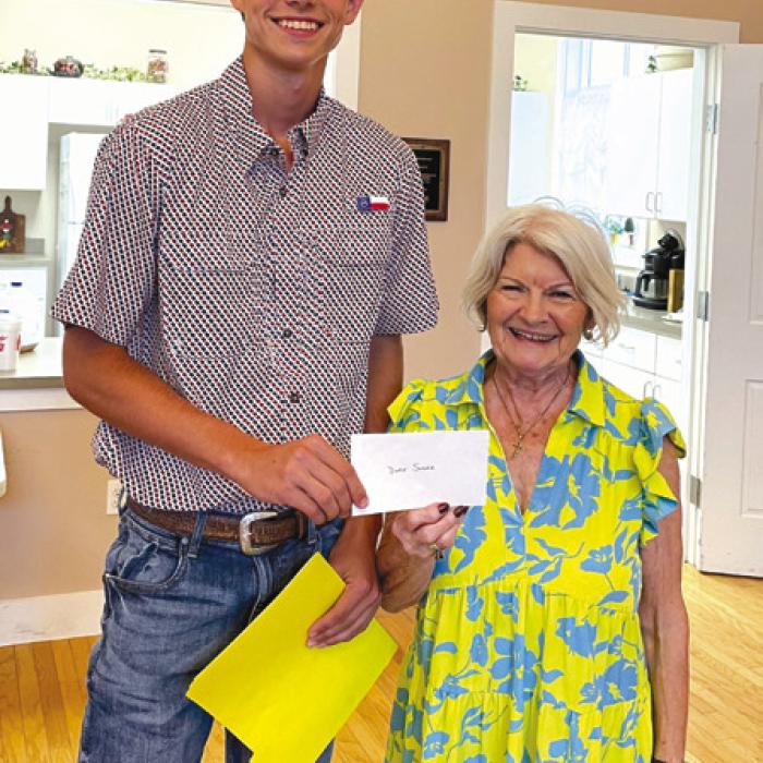Duke Sodek, Fayette CHS scholarship recipient, receiving a $500 check from CHS President Betty Danner.