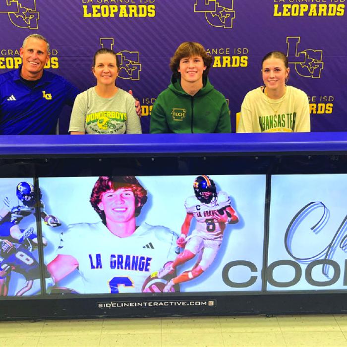 La Grange quarterback Clayton Cooper signed his letter of intent Wednesday to accept a scholarship offer to play football for Arkansas Tech University. He is shown above with his family at his signing ceremony. Left to right: Clayton’s dad and mom Kyle and Ginger Cooper, Clayton, and his sister Campbell. Photo by Jeff Wick