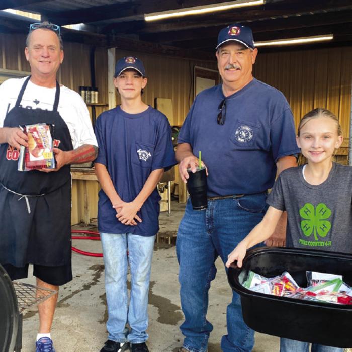Pictured are Michael Schlabach, Conner King, Bruce Kubena and Brylee Brugger at the first Neighbors Night Out.