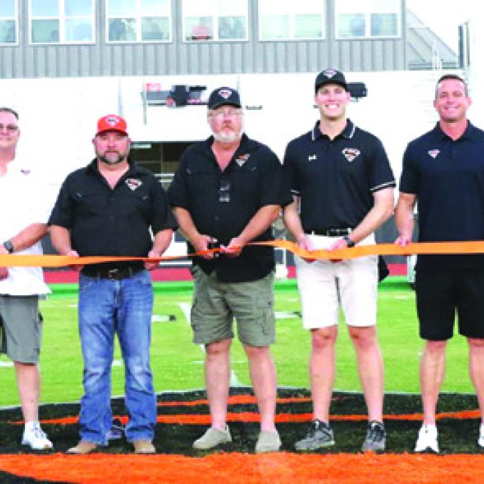 Schulenburg school officials cut a ribbon to dedicate the stadium renovations before Friday’s game. Photo by Audrey Kristynik