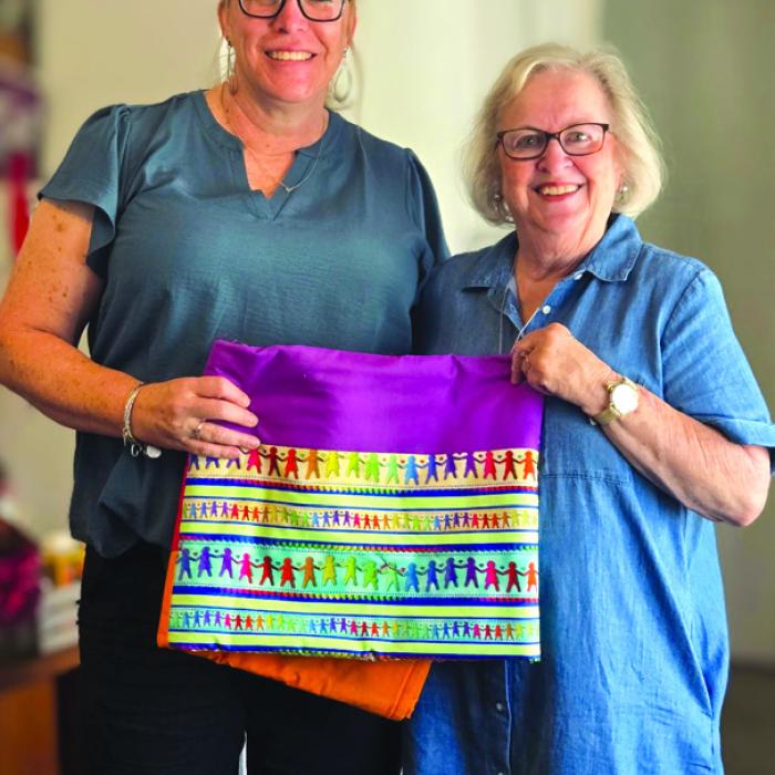 Martin Luther Lutheran Church Women of the ELCA Quilting Group presented fleece quilted throws to CASA of Bastrop, Fayette, and Lee Counties for their use. Court Appointed Special Advocates (CASA) improve the lives of children who experience child abuse and neglect in these counties. They train these advocates to support children and families involved in the child welfare system. Pictured are Kristi Bauer, left, Executive Director of CASA, and Leonita Sanders, coordinator of the MLLC WELCA unit.