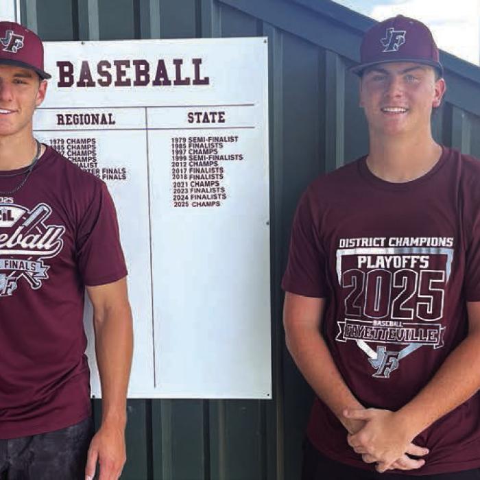 The four seniors on Fayetteville’s baseball team stand in front of a board of accomplishments at the stadium, which include the two state finalist finishes (2023 and 2024) that they were a part of, and their 2025 state title. Left to right, those seniors are Kole Schmitt, Jack Schley, Jason Halfmann and Mason Fenhaus. Photo by Jeff Wick