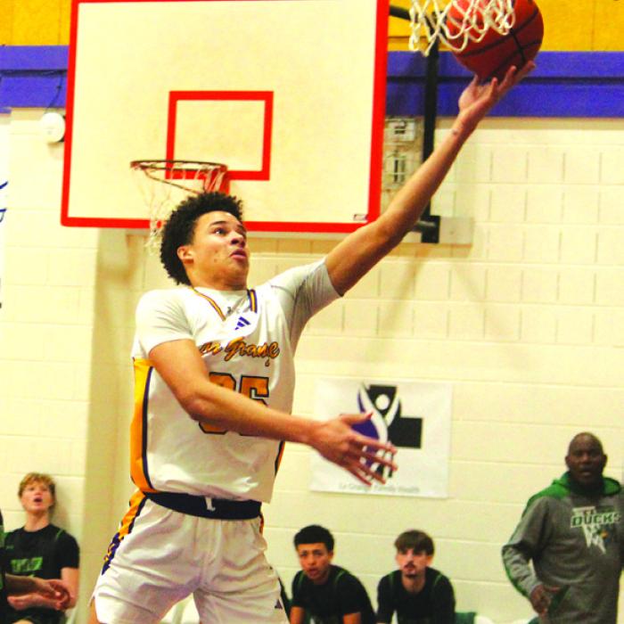 La Grange’s Brandon Mathis drives to the basket in Tuesday’s victory. Photo by Jeff Wick