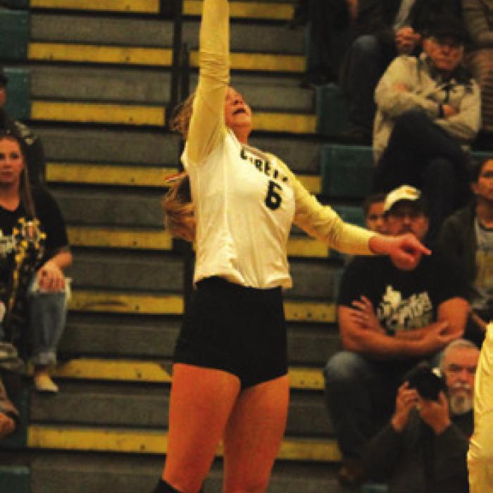 Jill Eilers spikes a ball in Saturday’s match.