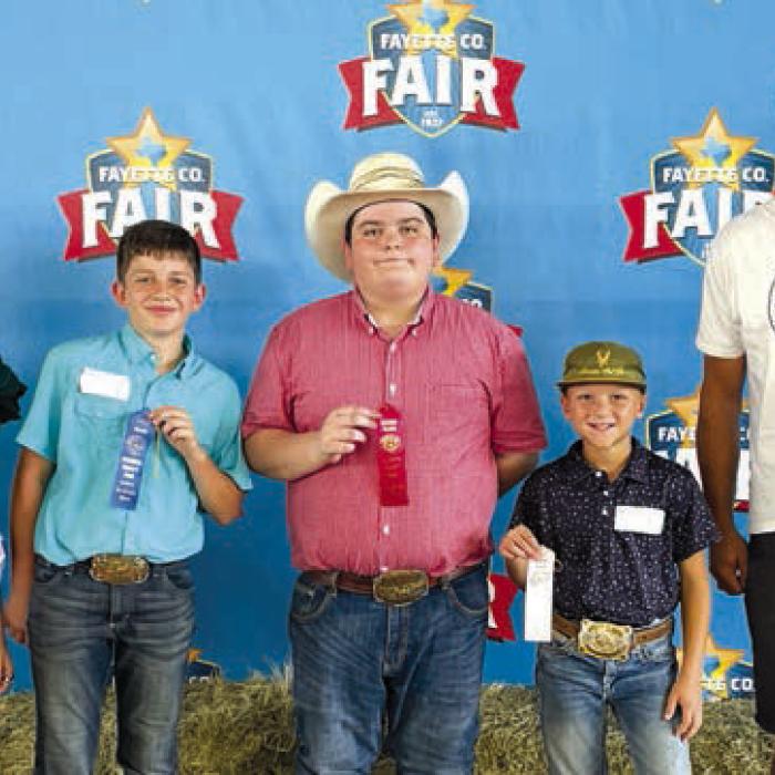 Herdsman Quiz Winners, Junior: Kylee Hoffmann-Teen Miss Lone Star State agHERculture, Bowen Williams, Rilan Karisch, Canaan Beseda, and sponsor Willie Joe’s Processing, representative Paddy Magliolo.