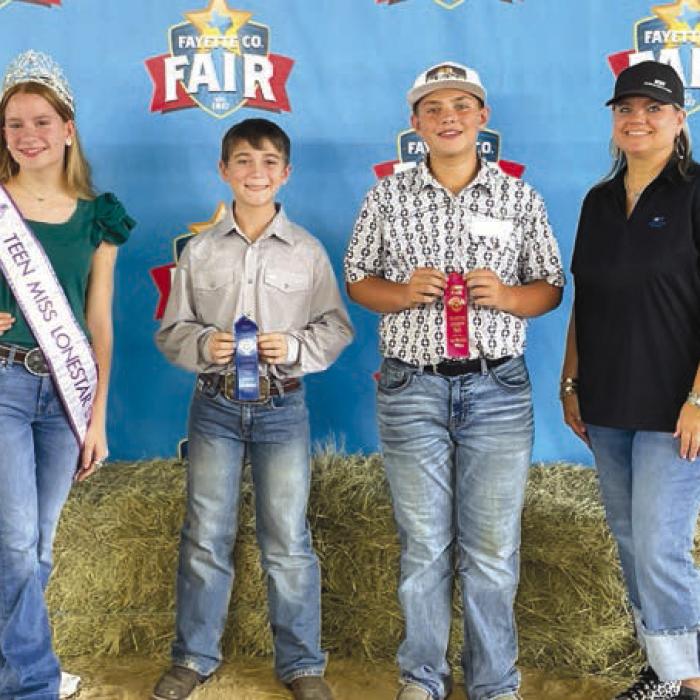 Salesmanship Winners, Intermediate: Kylee Hoffmann-Teen Miss Lone Star State agHERculture, Crockett Guenther, Draden Chudej, and sponsor National Bank and Trust, representative Tish Muniz.