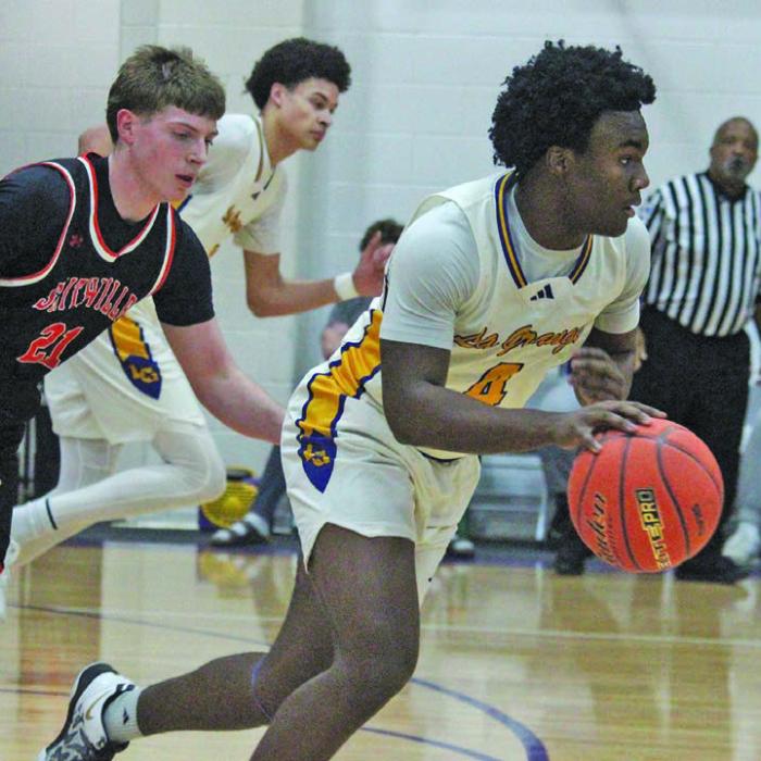 La Grange’s Dillan Johnson leads a fast break Tuesday against Smithville. Photo by Jeff Wick