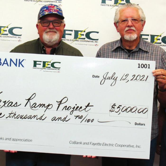 FEC General Manager Gary Don Nietsche presented a $5,000 grant from FEC and CoBank to volunteers of the Texas Ramp Project. Pictured are, left to right, Nietsche, Texas Ramp Project Regional Coordinator J. Frank Smith, and Dan Flagg and Bill Koenig, Texas Ramp Project volunteers.
