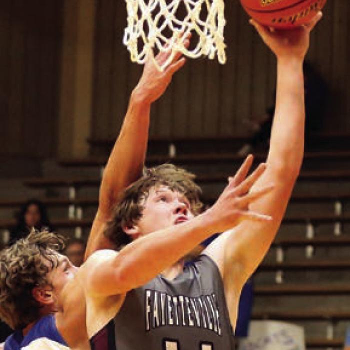 Lions Roar Their Way to State Basketball Tournament
