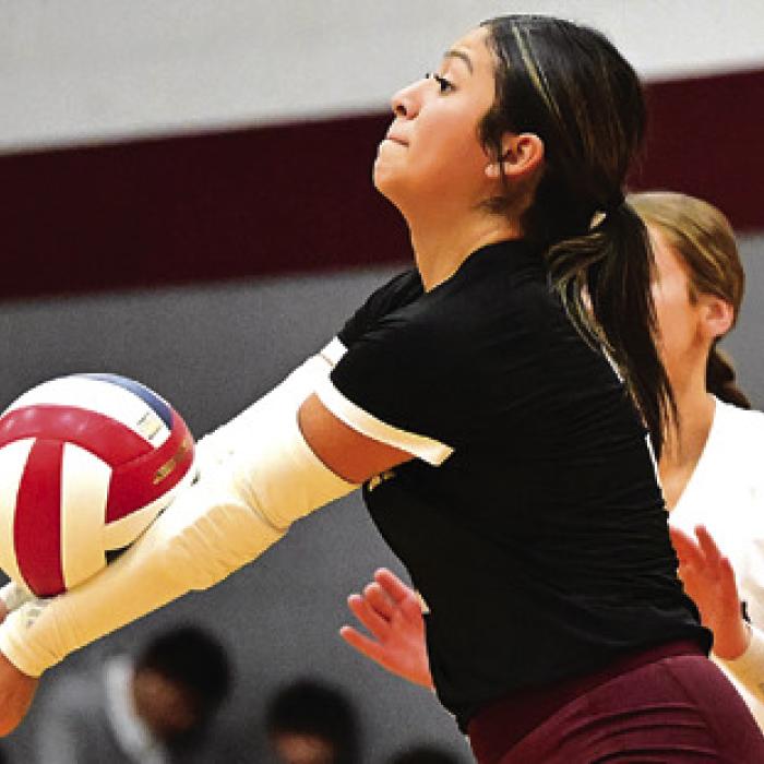 Flatonia’s Elzah Herrera digs a ball in Tuesday’s match against Yoakum.