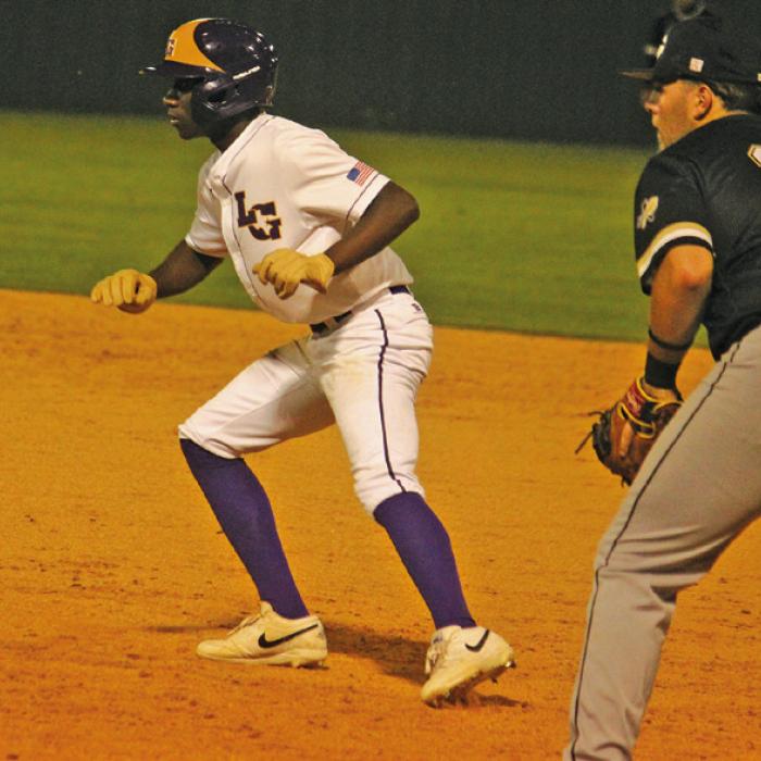 La Grange’s Howard Holmes leads off first base in Tuesday’s game. He had two of the Leps’ nine hits. Photo by Jeff Wick