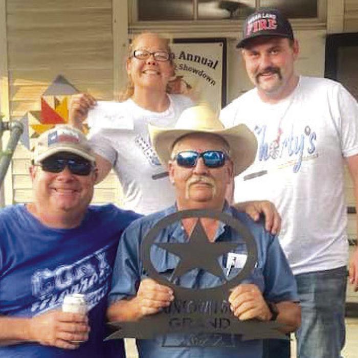 Grand Champion was awarded to the Double L Cookers, Lloyd Moreland, Chief Cook by Trish Herzog and Jake Franke.