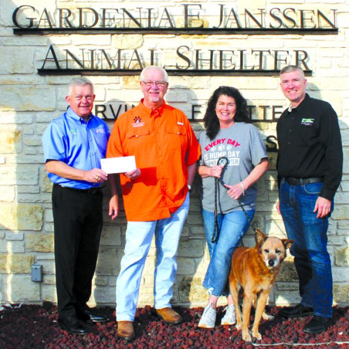 Colorado Valley Communications General Manager Kelly Allison, left, and Fayette Electric Cooperative General Manager/CEO Doug Lambert, right, proudly present a donation to Frank Reichert, Gardenia E. Jannsen Animal Shelter Board President, and Teresa Brown, Gardenia E. Jannsen Animal Shelter Executive Director, supporting the shelter’s mission to care for and protect animals in need.
