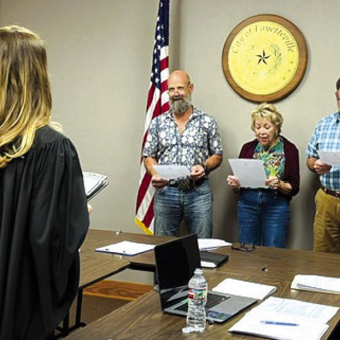 Fayetteville City Council members Todd Campbell, Debbie Lincke and Allen Jurecka sworn in by Justice of the Peace Jamie Moreau.