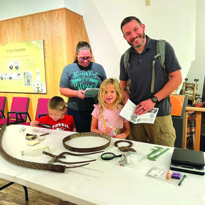 Families enjoy getting hands-on experience with historic artifacts related to Kreische Brewery and practicing their sorting and analysis skills.