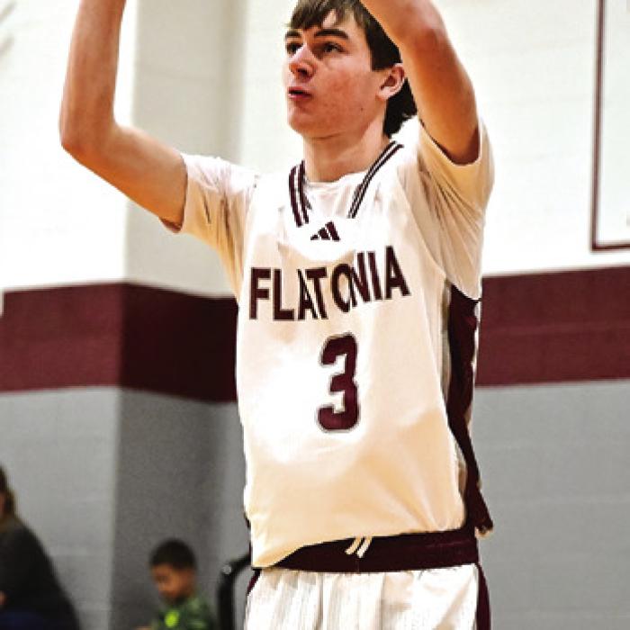 Flatonia’s Blake Kessler puts up three points for Flatonia in Friday’s boys win over Louise. Photo by Stephanie Steinhauser