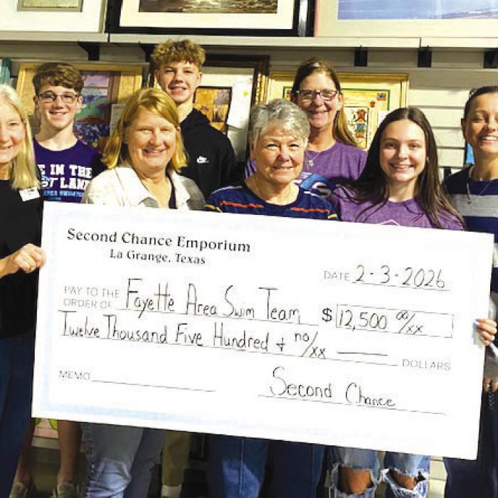 Second Chance Donates to Swim Team