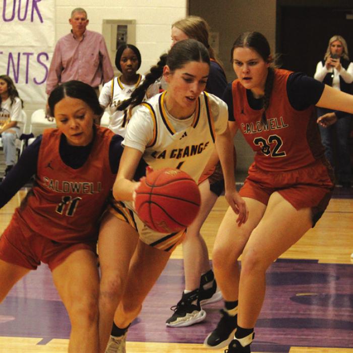 La Grange’s Macie Collier fights for control of the ball in Friday’s game against Caldwell. Photo by Jeff Wick
