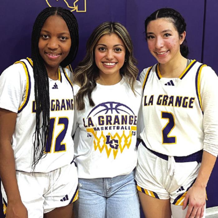 The three senior members of the Lady Leps basketball team pose after Friday’s win. Left to right: Kaylee Holmes, manager Alley Olvera and Landri Hernandez. Photo by Jeff Wick