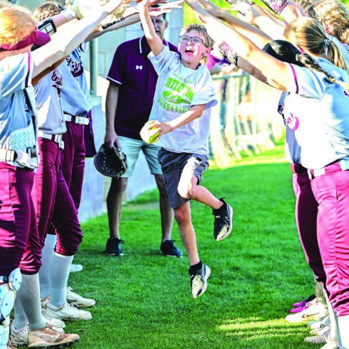 The Turtle Wing Foundation recently hosted more 2024 Turtle Wing Games where a child enrolled in special education gets to throw out the first pitch. Below is Gabriel Embrey with the Flatonia baseball team and above is Jax Laird during pregame introductions with the Flatonia softball team. Above photo by Stephanie Steinhauser