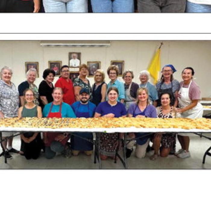 St. John's Kolache Crew showing off their kolaches to sell. Pictured back from left: Gladys Polasek, Ruby Miltenberger, Gladys Schmitt, Pat Stastny, Glenda Munsch, Margie Svrcek, Angie Pavlicek, Madeline Kovar, Rose Rohde, Betty Kovar, and Roxanne Rohde; front row: Kayla Goebel, Michele Berger, Herman C. Schramm, Avery Berger, Rose Michalec, and Kim Kovar.
