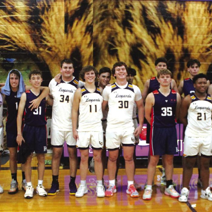 The members of the La Grange and Australian Pittwater House varsities pose after their basketball game Wednesday. Photo by Jeff Wick