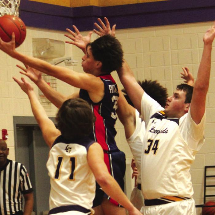 A trio of Leps, Clayton Cooper, Reece Nygren and Devonte McKenzie, converge on this Australian player as he drives to the basket.