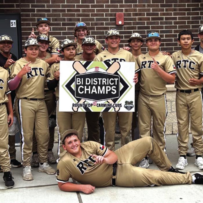 The members of the Round Top-Carmine baseball team celebrate their bi-district series victory over Hull-Daisetta Thursday in Huntsville.