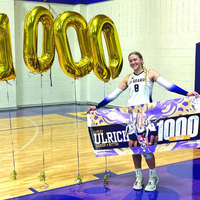 Following Tuesday’s match, La Grange’s Carley Ulrich was honored for getting her 1,000th career kill with the Lady Leps. Photo by Jeff Wick