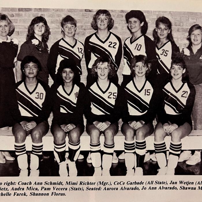 This caption for the photo is updated to include married names: Back: Coach Ann Schmidt-Rigden, Mimi Richter Lahodny (Mgr.), Cece Garbade Oden (All State), Jan Wetjen Anderson (All State), Gay Len Rietz Gaskey, Audra Mica Janecka, Pam Vecera Beesley (Stats). Front: Aurora Alvarado Kalina-Young, Jo Ann Alvarado Chavez, Shawna Mica Bruns (All State), Michelle Farek Sexton, Shannon Florus Dyer.