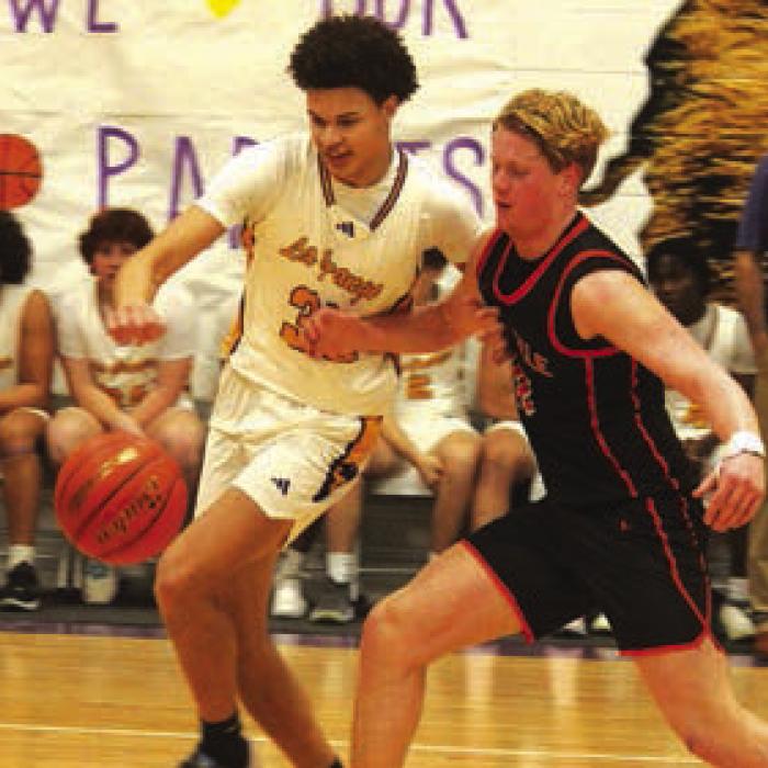 La Grange’s Brandon Mathis tries to grab a loose ball in the home finale against Smithville.