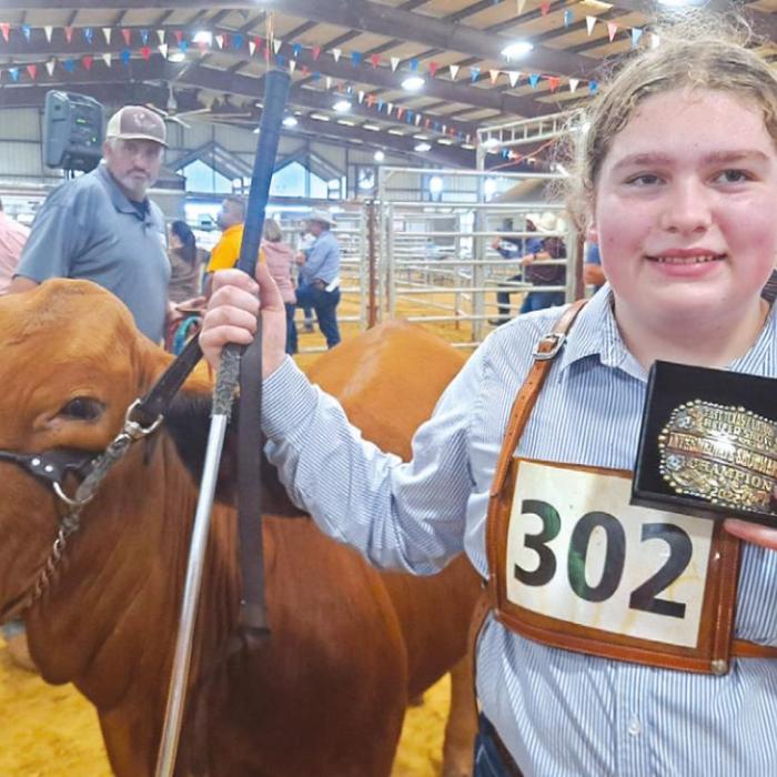 Rheagan and Rilan Karisch attended the 2022 JBBA Spring Fling Heifer Show in Crockett recently. Rheagan is pictured here with the belt buckle that she won as the Intermediate Showman Champion.