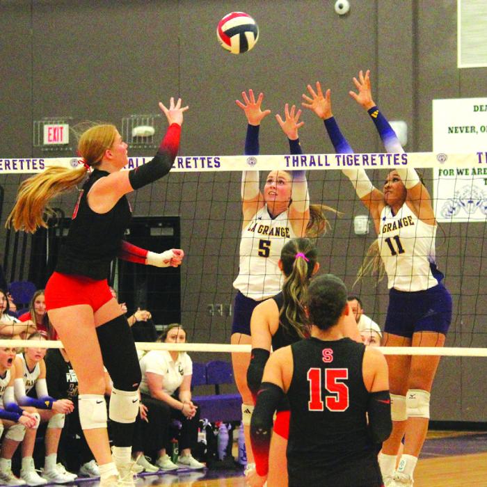 La Grange’s Campbell Cooper, center, and Brion Williams, right, try to block the hit of Salado’s Elsie Law, a 6-foot-2 University of Arkansas signee. Photo by Jeff Wick