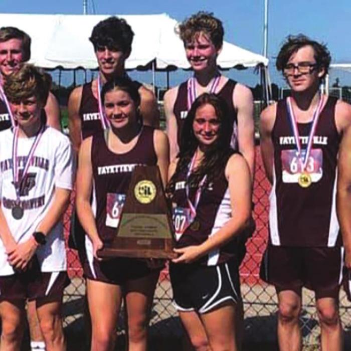 The members of the Fayetteville cross country team pose Monday in Corpus Christi after the boys won the Region IV-1A team title. As an individual, Fayetteville’s Emma Jurecka also advanced to state.