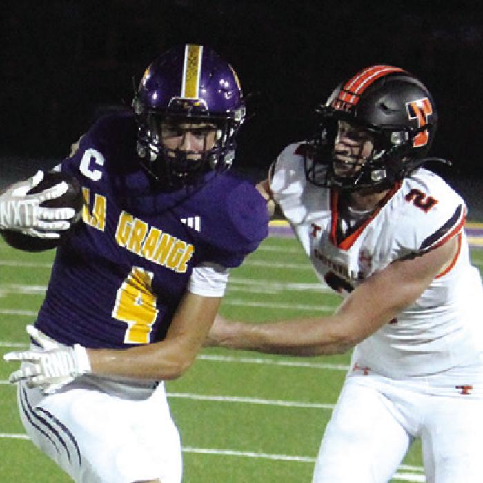 La Grange’s Mason Kleiber fights for yards after a catch Friday. Photo by Jeff Wick