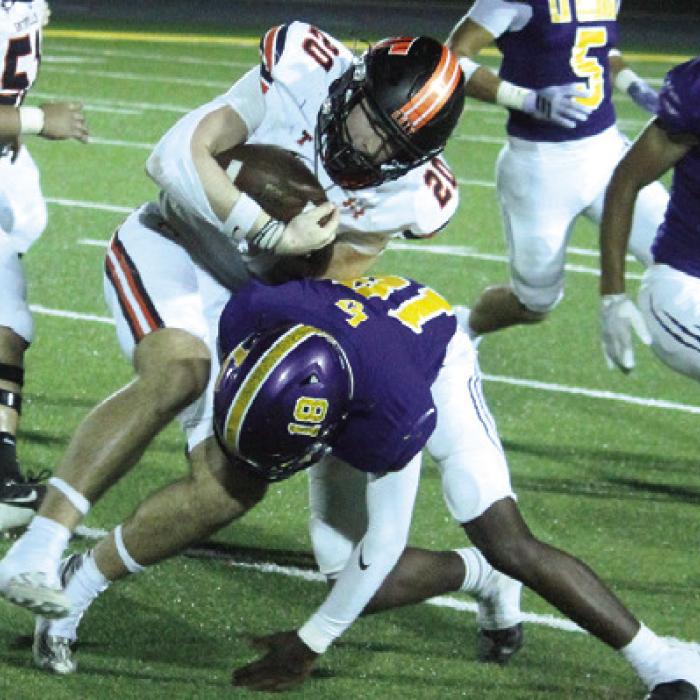 La Grange’s Howard Holmes stops Smithville’s Justin Gurley in his tracks Friday. Photo by Jeff Wick