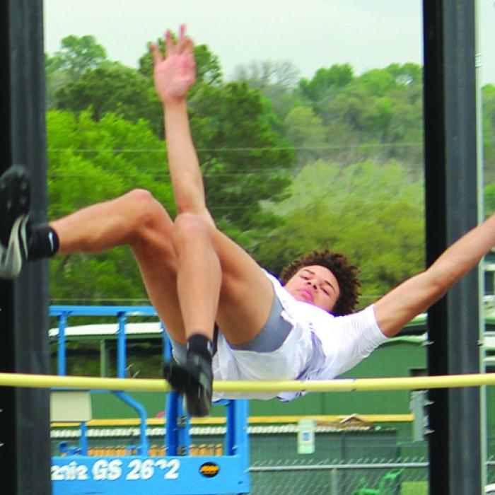 La Grange’s Brandon Mathis flies over the bar in the varsity high jump Thursday. He was fourth, clearing 5-8. Photo by Jeff Wick