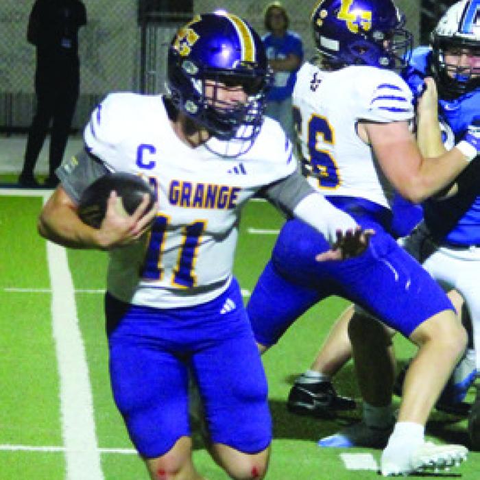 Leps quarterback Eli Gillum runs the ball Friday.