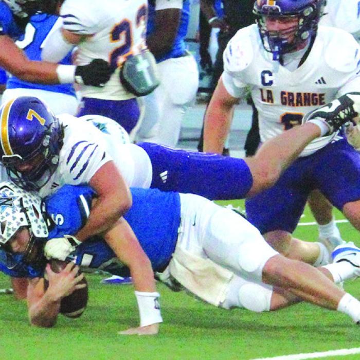 La Grange’s Christian Biles tackles Navasota quarterback Jace Jablonski. Photo by Jeff Wick