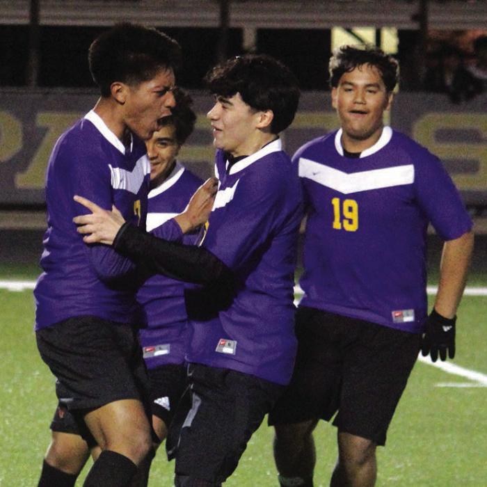 La Grange’s Aaron Torres, left, is mobbed by his teammates after scoring what would be the game-winning goal in Tuesday’s 1-0 district opening victory over Taylor. Photo by Jeff Wick