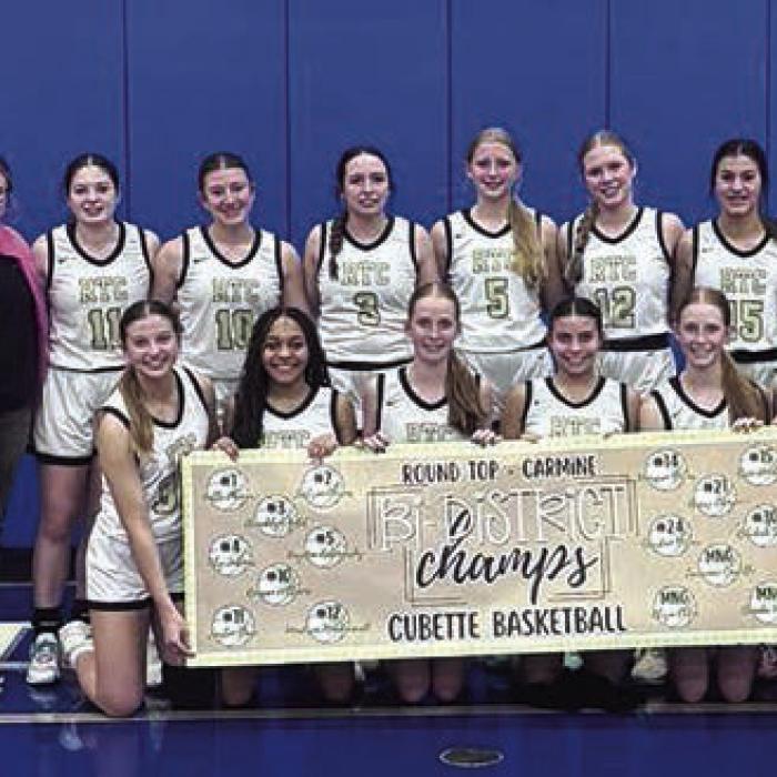 The members of the Round Top-Carmine girls basketball team celebrate their first round playoff victory in Yoakum Tuesday.