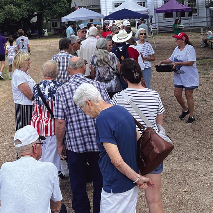 Unlike some church picnics, Dubina doesn’t have a drive-thru line, but they do bring free sweet tea to folks waiting in line.