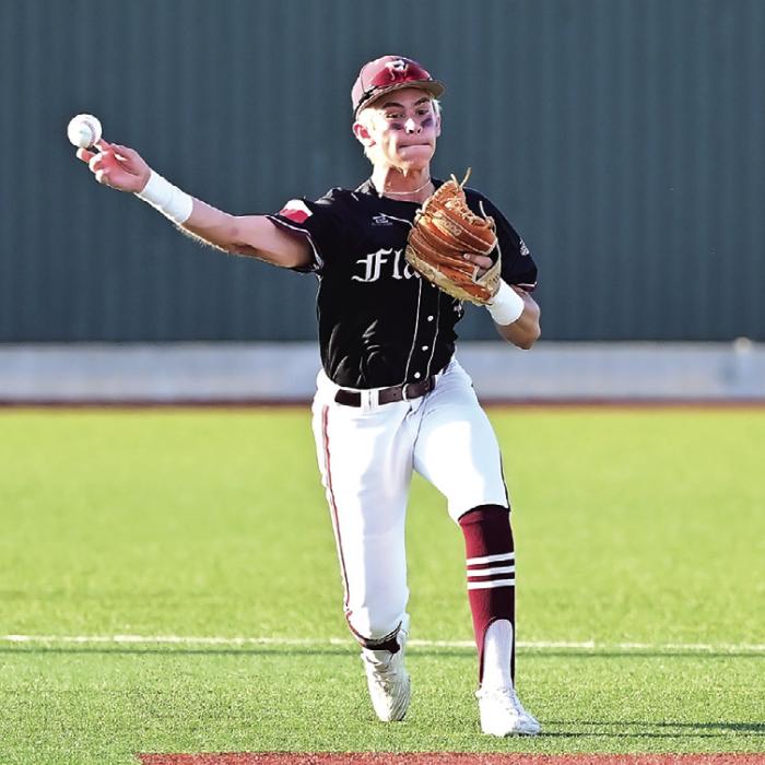 Cale Janecka throw to Neito at first base to get the out for the Flatonia Bulldogs in the win over the Kenedy Lions to move on to the next level of playoffs. Photo by Stephanie Steinhauser