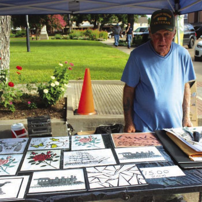 Randall Beck of Fayetteville was selling pen and ink drawings he has done.