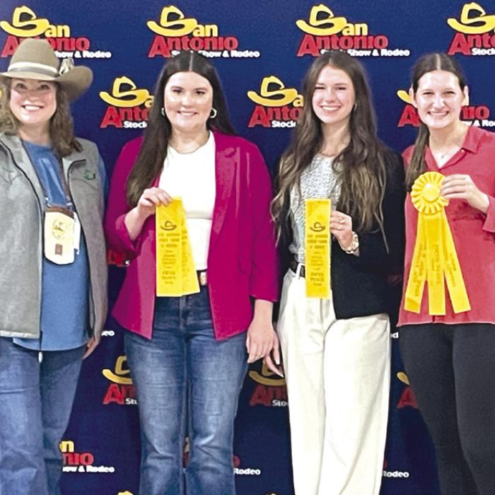 Senior girls team placed 5th overall. Pictured (from left), with a representative from the livestock show are Madeline Willrich, Harper Mau, and Elena Supak.