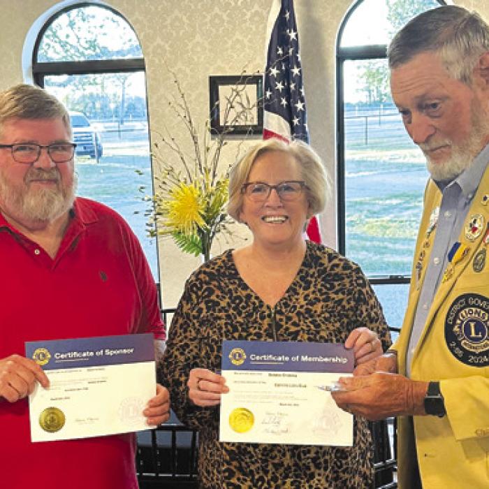 Debbie Grabsky, center, was inducted as a new member of the Carmine Lions Club by District Governor Julius Bartek, right. Also pictured is Daniel Grabsky, left, who was her sponsor.