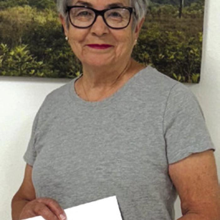 Maria Bohac, a volunteer for Senior Connections, delivered a donation of $215 from her 1970 high school class. Their class participated in the Schulenburg Festival Parade and won first place for class float.