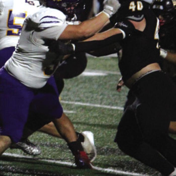 La Grange offensive lineman Sterling Walla battles his Sealy counterpart in Friday’s game.